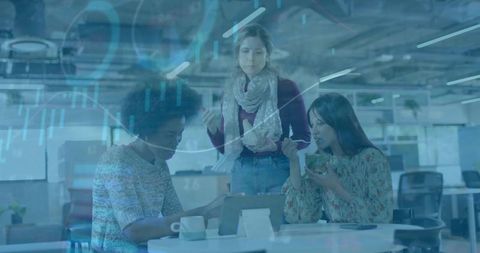Three Professionals Collaborating Over Tablet in Modern Office with Data Visualization Overlay