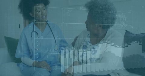 Nurse discussing health data with senior patient at home