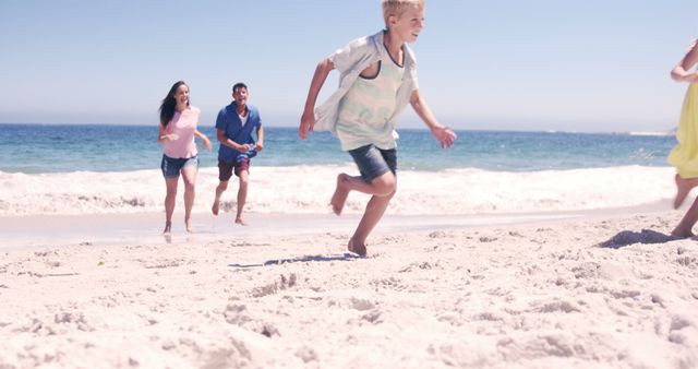 Children and Parents Running on Sandy Beach Under Blue Sky - Download Free Stock Images Pikwizard.com