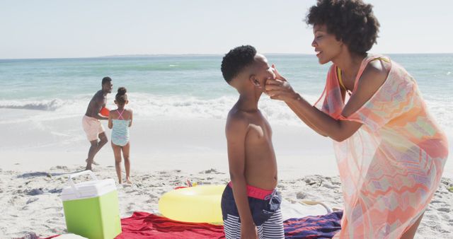 Family Enjoying Beach Day with Playful Moments by the Ocean - Download Free Stock Images Pikwizard.com