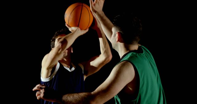 Two young Caucasian men engage in a competitive basketball game - Download Free Stock Photos Pikwizard.com