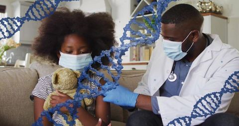 Pediatric clinician administering vaccine during home visit to masked child holding teddy