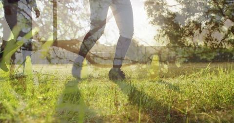 Dynamic Football Scene with Nature Overlay Symbolizing balance - Download Free Stock Images Pikwizard.com