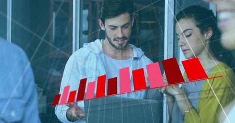 Team Analyzing Financial Growth in Modern Office Environment