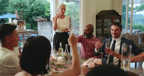 Elegant wedding reception dinner with diverse guest celebration