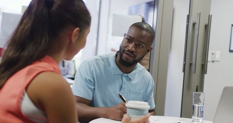 Diverse coworkers collaborating in modern office workplace