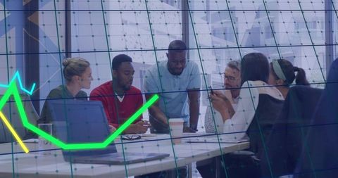 Team leader guiding diverse group around table with neon data chart overlay for strategy