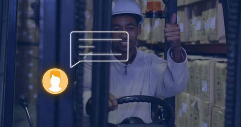 Forklift operator giving thumbs-up wearing hard hat in warehouse with digital ui overlays