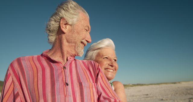 Happy Elderly Couple Enjoying Beach Time Together - Download Free Stock Images Pikwizard.com