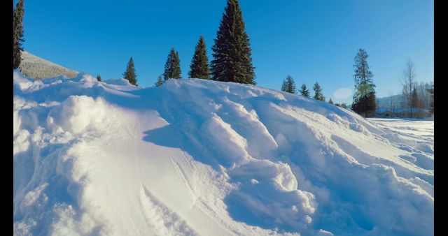 Snow-covered landscape glistens under a clear blue sky - Download Free Stock Photos Pikwizard.com