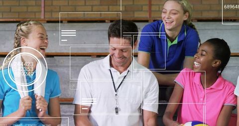 Team Enjoyment: Youth Sports Coach Sharing Laugh With Players