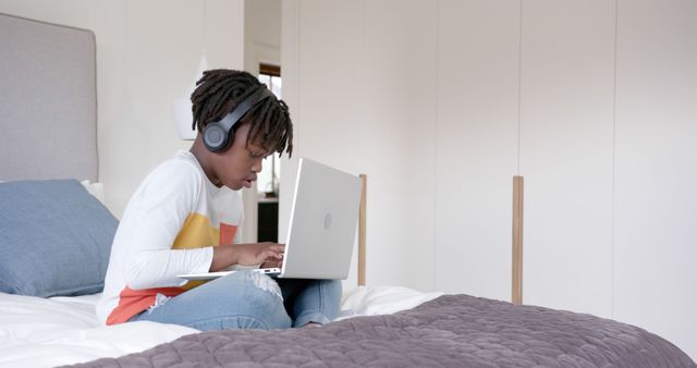 Young Boy Using Laptop with Headphones for Online Learning at Home - Download Free Stock Images Pikwizard.com