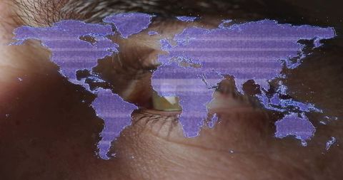 Scanning male eye with purple world map overlay for global cybersecurity identity concept