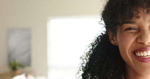 Smiling african american woman closeup backlit portrait showing joyful expression
