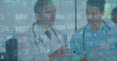 Doctors Analyzing Healthcare Data with Digital Display