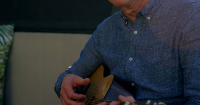 Senior Man Playing Acoustic Guitar Relaxing Outdoors - Download Free Stock Images Pikwizard.com