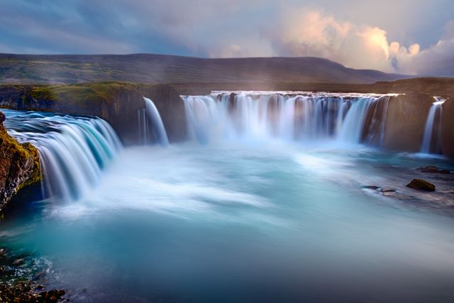 Majestic Waterfall with Cascading Waters in Misty Sunrise Landscape - Download Free Stock Photos Pikwizard.com