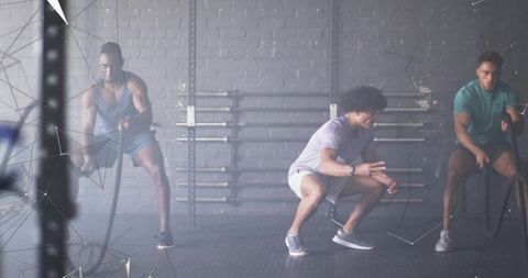 Dynamic workout with battle ropes in urban gym