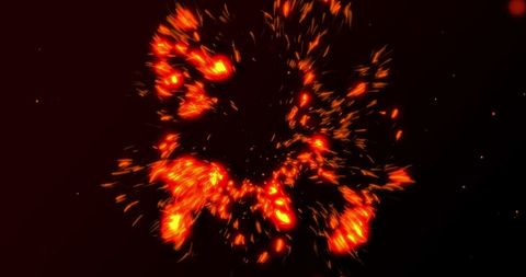 Explosive glowing red particles on dark background