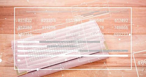 Lying pleated pink mask on wood tabletop showing digital hud overlay and gold corners