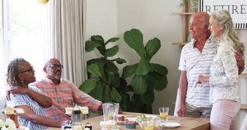 Seniors enjoying conversation and snacks at gather