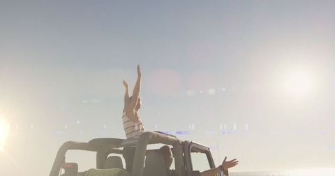 Joyful Road Trip on Sunny Day, Woman Embraces Freedom