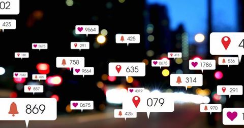 Social Media Notifications Over City Traffic Blur
