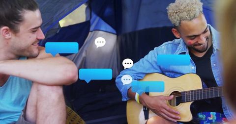 Outdoor camping guitar jam with digital conversation overlays