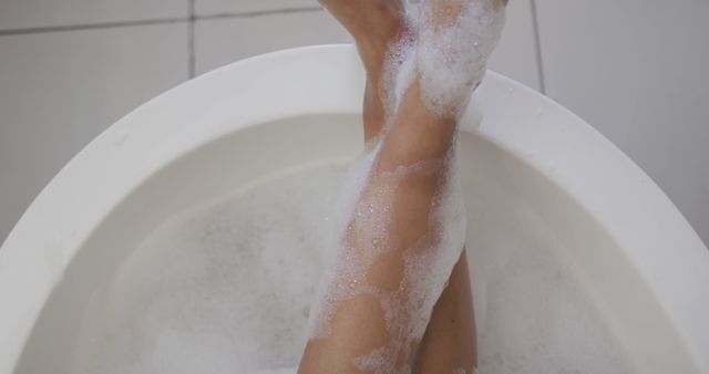 Mid section of biracial woman taking a bath - Download Free Stock Photos Pikwizard.com