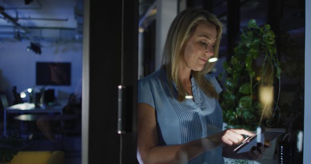 Businesswoman Working Late in Modern Office on Digital Tablet - Download Free Stock Images Pikwizard.com