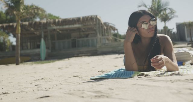 Woman Relaxing on Beach Towel on Sandy Shore - Download Free Stock Images Pikwizard.com