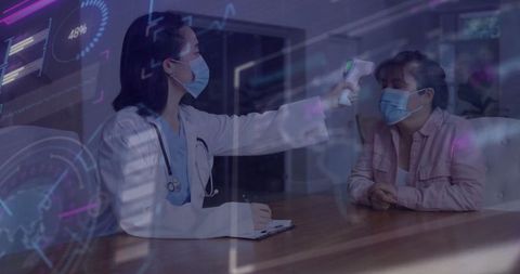 Doctor measuring patient temperature with infrared thermometer