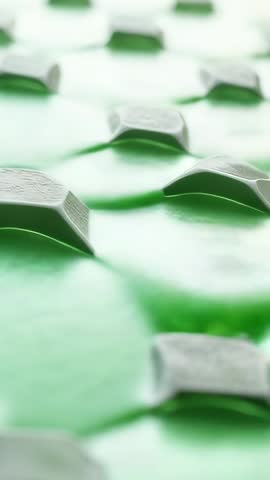 Vertical sci-tech grid collecting luminous green fluid on glowing nodes, biomimicry motion