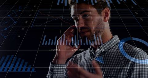 Businessman Discussing Modern Analytics on Phone with Overlaid Financial Charts and Graphs