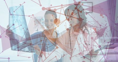 Female medical professionals analyzing x-ray with digital network overlay