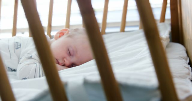 Cute baby sleeping in his bed at home - Download Free Stock Photos Pikwizard.com