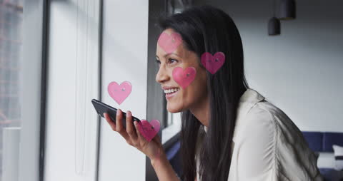 Businesswoman Using Smartphone with Animated Heart Overlays