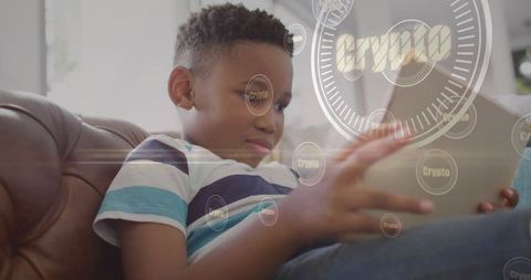 Child using tablet with crypto digital overlay on sofa exploring blockchain and finance