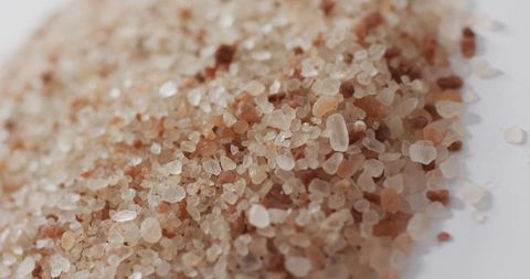 Close-up of Himalayan Pink Salt Crystals on White Surface