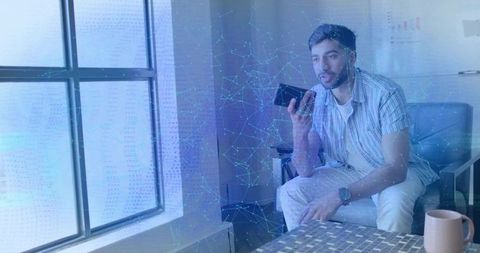 Man Using Smartphone Communicating through Modern Technology at home or at work