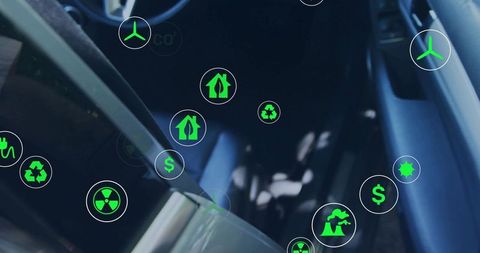 Electric car interior showing eco icons floating over dashboard and steering wheel