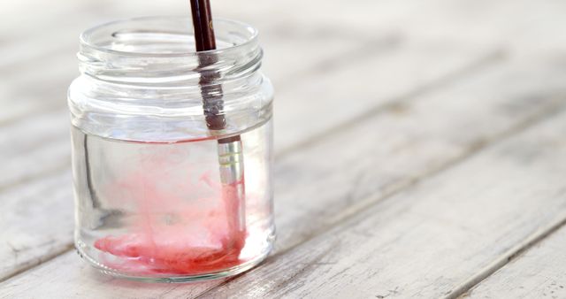 Paintbrush in Jar Creating Colorful Swirl - Download Free Stock Images Pikwizard.com