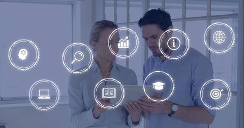 Business Professionals Analyzing Data on Tablet with Digital Interface Elements