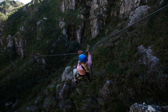 Woman Zip Lining Through Mountainous Terrain - Download Free Stock Photos Pikwizard.com