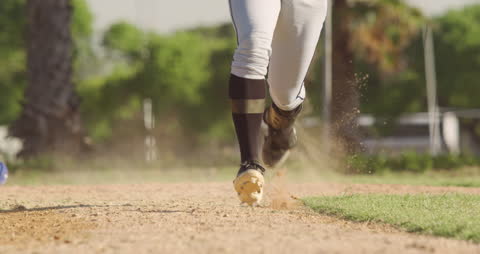 Baseball Player Running Fast on Field in Intense Game Action