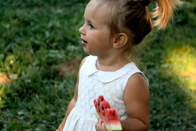 Young Girl Eating Watermelon Outdoors on Sunny Day - Download Free Stock Photos Pikwizard.com