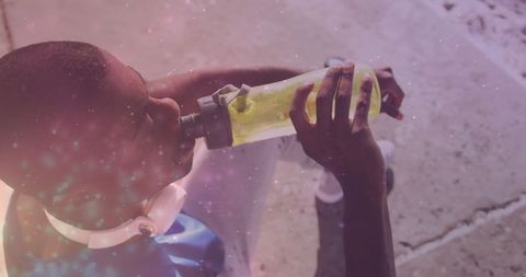 Athlete Resting While Hydrating During Exercise