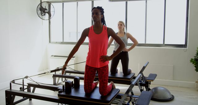 Women Practicing Pilates on Reformers in Modern Studio - Download Free Stock Images Pikwizard.com