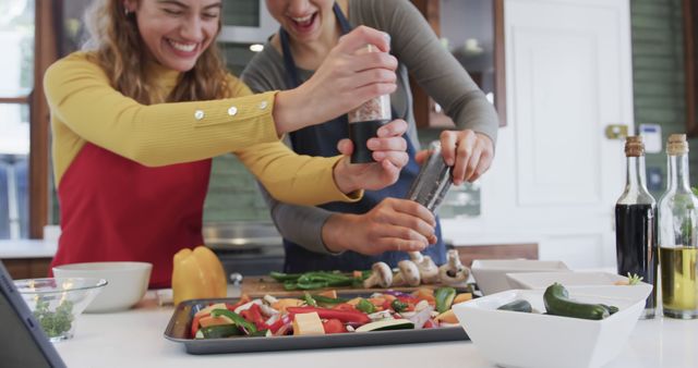 Happy Lesbian Couple Preparing Veggies Together in Bright Kitchen - Download Free Stock Images Pikwizard.com