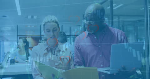 Busy Professionals Analyzing Financial Data in Modern Office